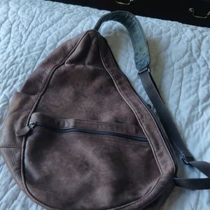 Brown leather crossbody backpack